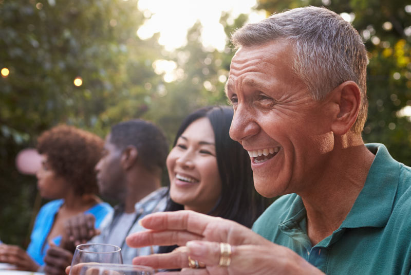 Bone graft patient enjoying food & friends outdoors